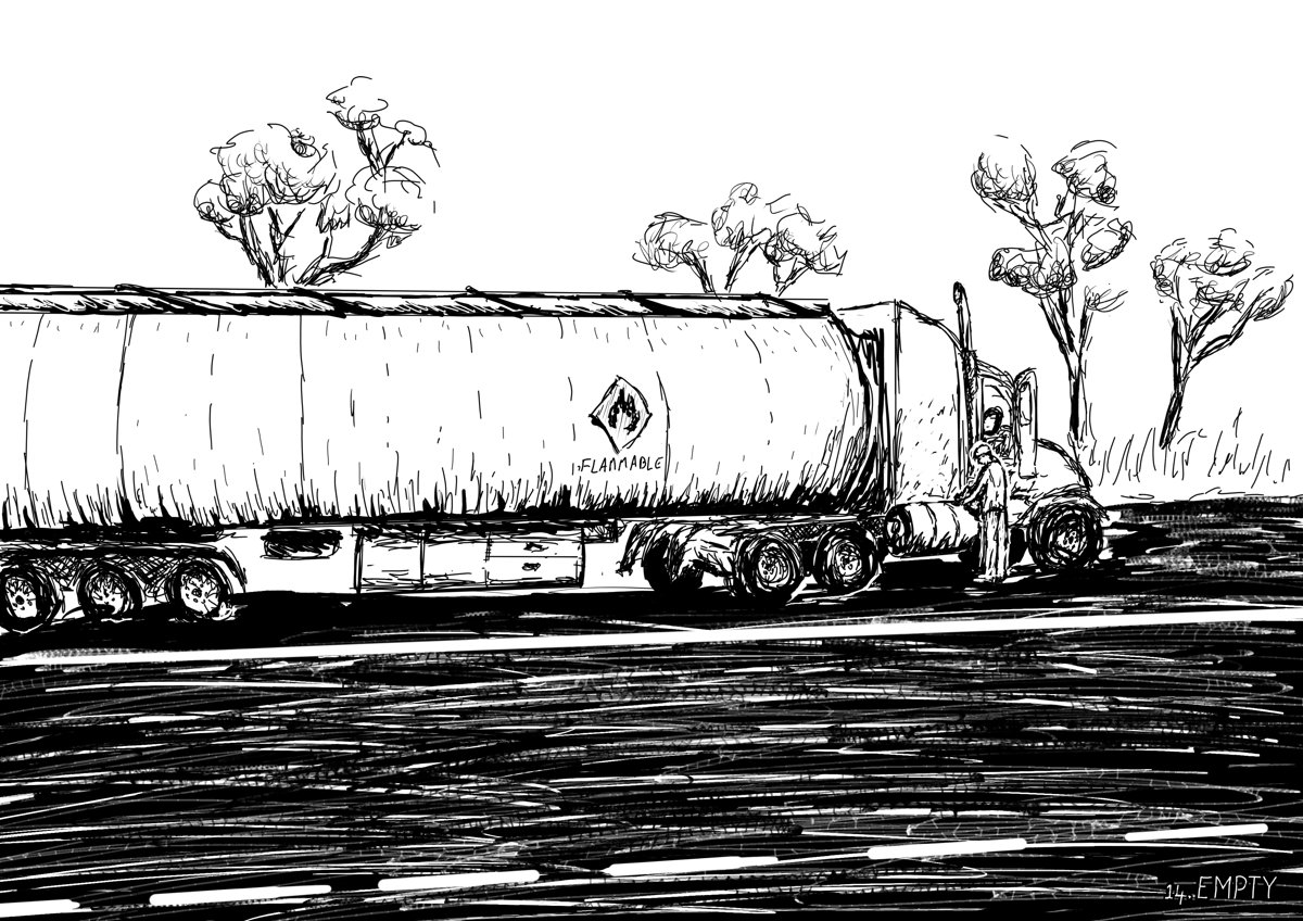 A large fuel truck is pulled over by the side of the road. The driver inspects the fuel tank.